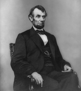 Abraham_Lincoln_seated,_Feb_9,_1864